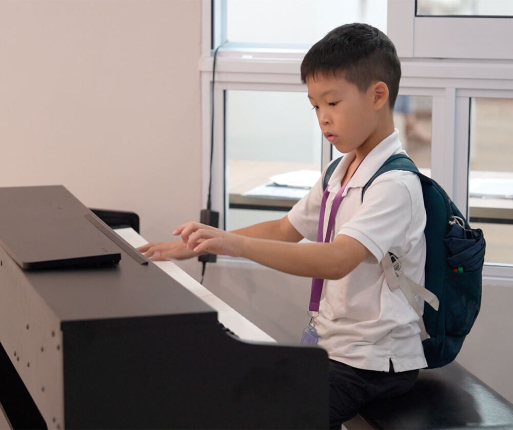 student playing the piano